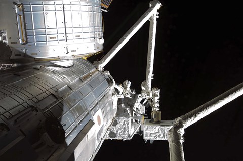 Framed Robotic Arm of the Japanese Experiment Module assists in installing components on the Japanese Exposed Facility Print