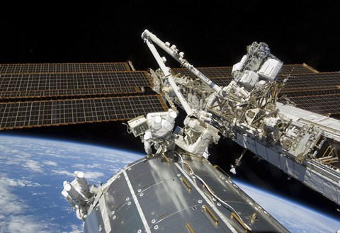 Framed Astronauts Perform a Series of Tasks on the Exterior of the International Space Station Print