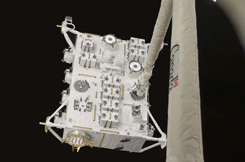 Framed Japanese Experiment Module Exposed Facility in the Grasp of the Shuttle&#39;s Remote Manipulator System Arm Print