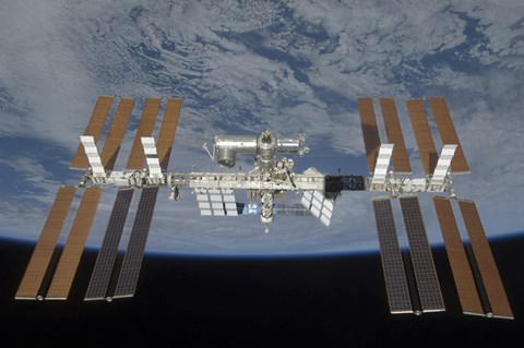 Framed International Space Station, Backdropped by the blackness of space and Earth&#39;s horizon Print