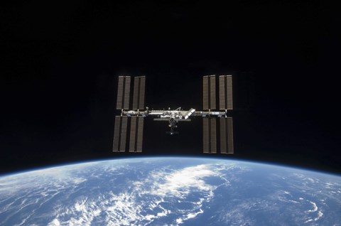 Framed International Space Station Backdropped by Earth&#39;s horizon Print