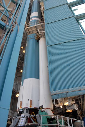 Framed Second Solid Rocket Motor is Moved into Place Alongside the Delta II First Stage Print