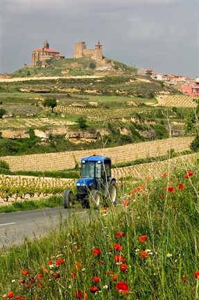 Framed Blue tractor on rural road, San Vicente de la Sonsierra Village, La Rioja, Spain Print