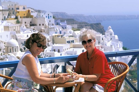 Framed Women Having Coffee on Cafe Terrace, Santorini, Greece Print