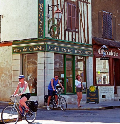 Framed Wine Shop and Cycling Tourists, Chablis, France Print