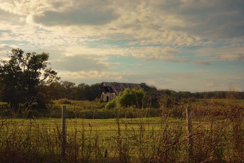 Framed Rusty Barn At Sunset Print