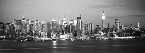 Framed Skyscrapers lit up at night in a city, Manhattan, NY Print