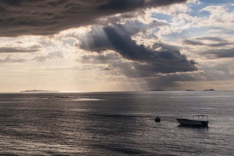 Framed Dramatic light over a little boat, Mamanucas Islands, Fiji, South Pacific Print