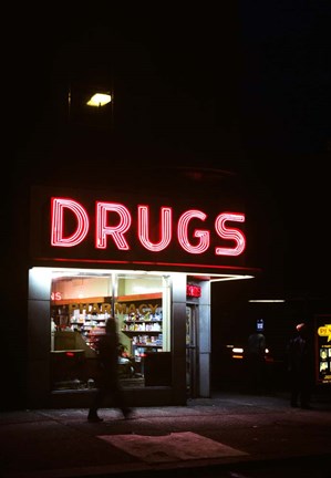 Framed 1980s Drug Store At Night Pink Neon Sign Print