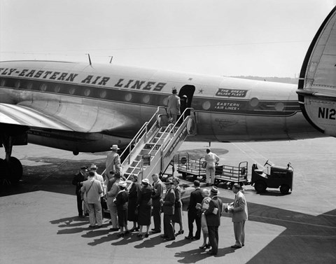 Framed 1950s Group Of Passengers Boarding Airplane Print