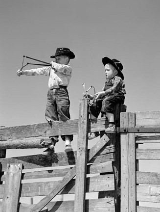 Framed 1950s Two Young Boys Dressed As Cowboys Print