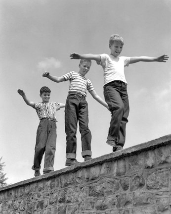 Framed 1950s Three Laughing Boys Walking On Top Of Stone Wall Print