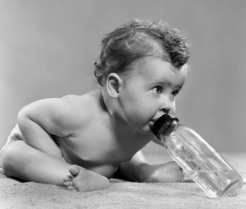 Framed 1950s Baby Leaning Forward Drinking From Bottle Print
