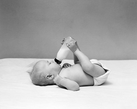 Framed 1940s Baby Prone Drinking From Milk Bottle Print