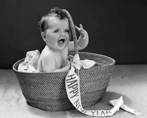 Framed 1940s Baby In Wicker Basket With Happy New Year Banner Print