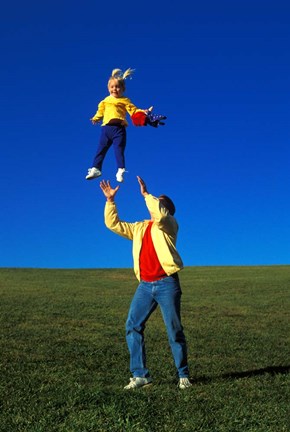 Framed 1990S Father Tossing Daughter Up In The Air Print