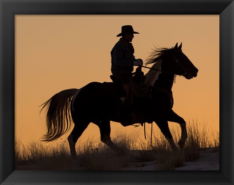 Framed Cowboy Riding His Horse Winters Snow Silhouetted At Sunset Print