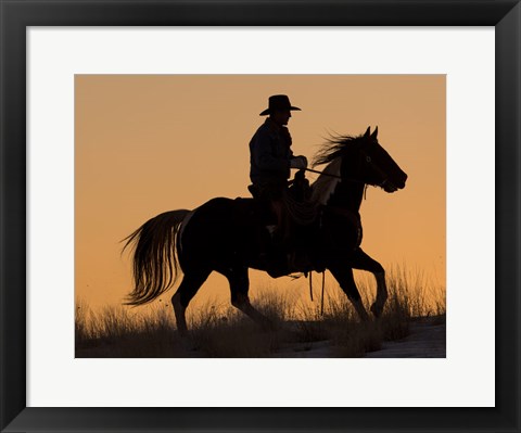 Framed Cowboy Riding His Horse Winters Snow Silhouetted At Sunset Print