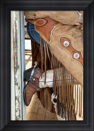 Framed Cowgirl Standing In Doorway Of Old Log Cabin Print