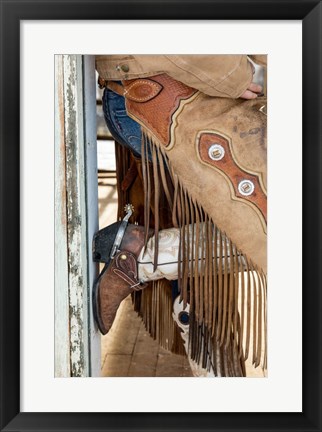 Framed Cowgirl Standing In Doorway Of Old Log Cabin Print