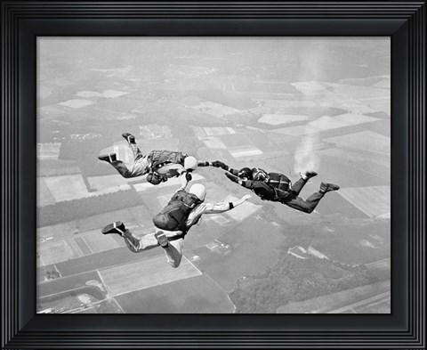 Framed Three Men Holding Hands Sky Diving Print