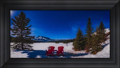 Framed Red Chairs Under a Moonlit Winter Sky at Two Jack Lake Print
