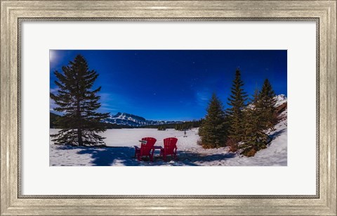 Framed Red Chairs Under a Moonlit Winter Sky at Two Jack Lake Print