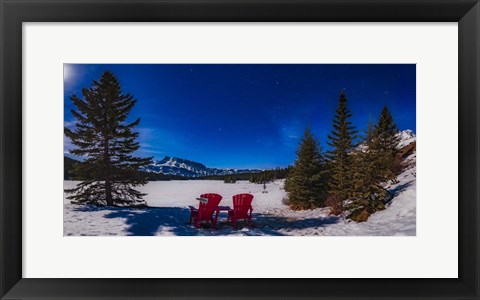 Framed Red Chairs Under a Moonlit Winter Sky at Two Jack Lake Print