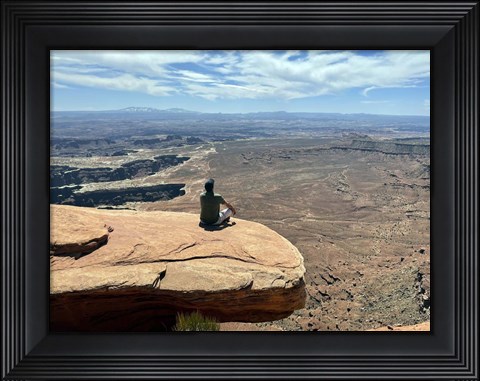Framed Adult Male Sitting on the Edge Of a Stunning Viewpoint Print