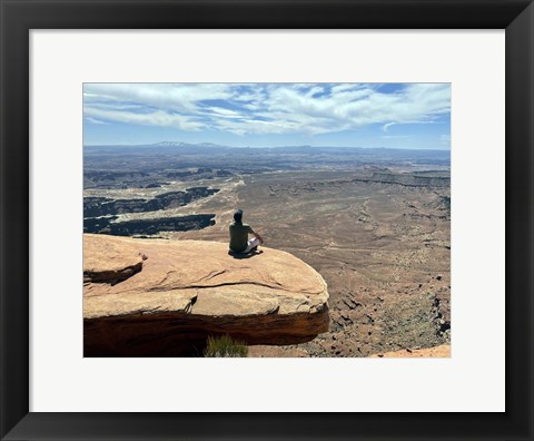 Framed Adult Male Sitting on the Edge Of a Stunning Viewpoint Print