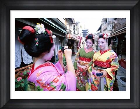 Framed Three geishas, Kyoto, Honshu, Japan (taking pictures) Print
