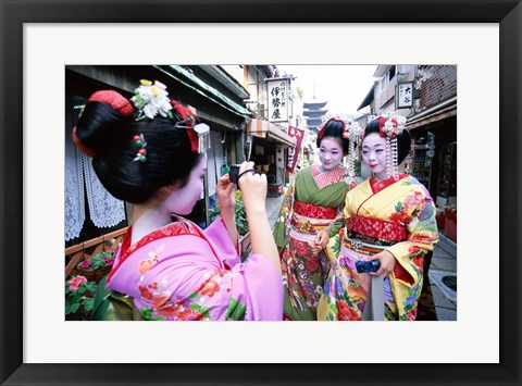 Framed Three geishas, Kyoto, Honshu, Japan (taking pictures) Print