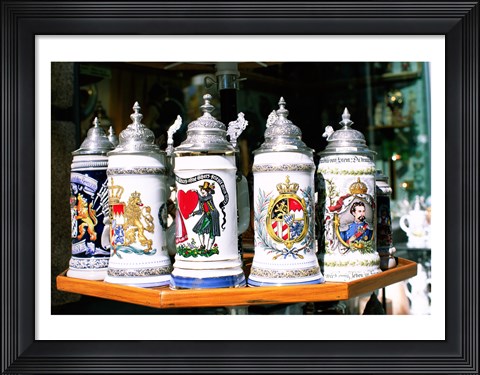 Framed Group of beer steins on a table, Munich, Germany Print