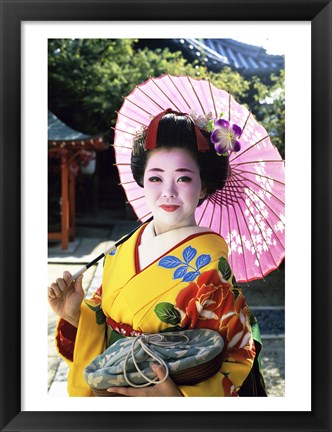 Framed Geisha holding a parasol, Kyoto, Japan Print