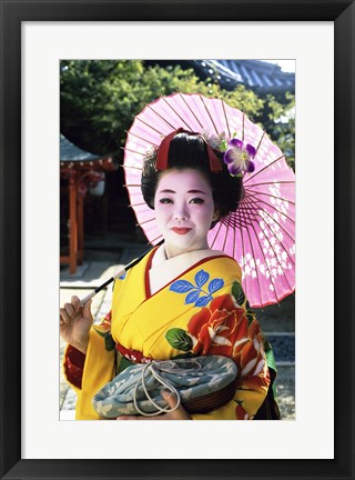 Framed Geisha holding a parasol, Kyoto, Japan Print