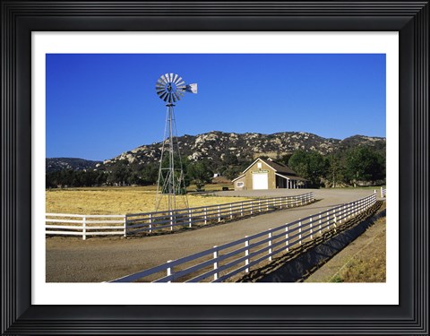 Framed Industrial windmill on a farm, California, USA Print