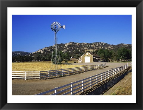 Framed Industrial windmill on a farm, California, USA Print