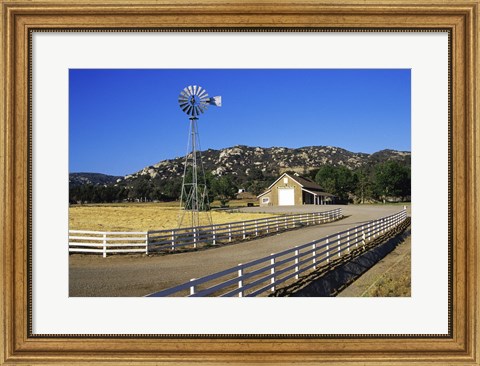 Framed Industrial windmill on a farm, California, USA Print