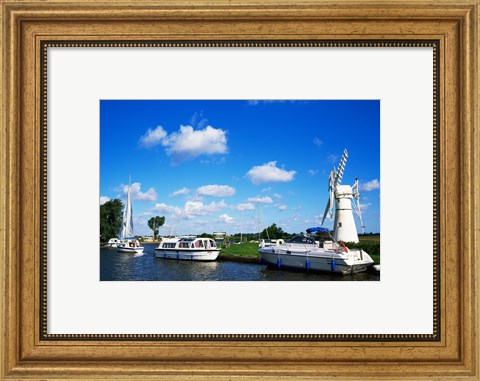 Framed Boats moored near a traditional windmill, River Thurne, Norfolk Broads, Norfolk, England Print