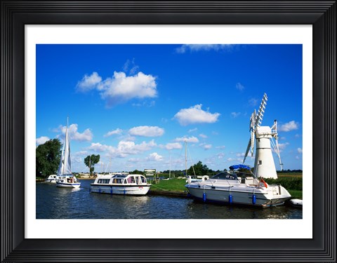 Framed Boats moored near a traditional windmill, River Thurne, Norfolk Broads, Norfolk, England Print