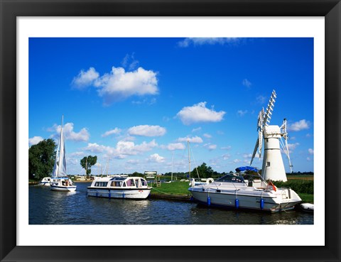 Framed Boats moored near a traditional windmill, River Thurne, Norfolk Broads, Norfolk, England Print