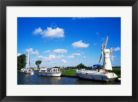 Framed Boats moored near a traditional windmill, River Thurne, Norfolk Broads, Norfolk, England Print