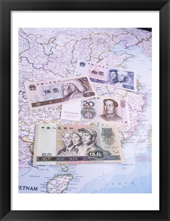 Framed Close-up of yuan notes on a map Print