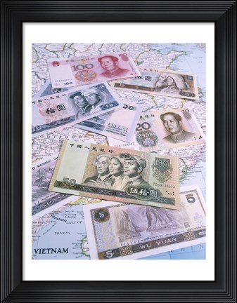 Framed Close-up of yuan notes on a map Print