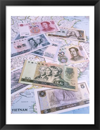 Framed Close-up of yuan notes on a map Print