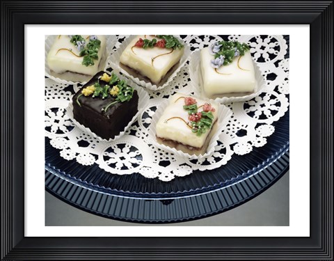 Framed Close-up of assorted cakes on a plate Print
