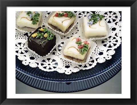 Framed Close-up of assorted cakes on a plate Print