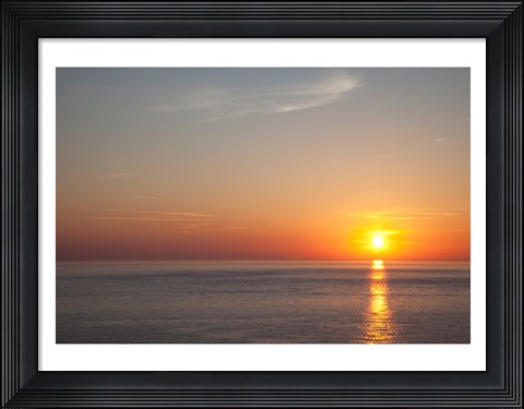 Framed Sunrise over the sea Print