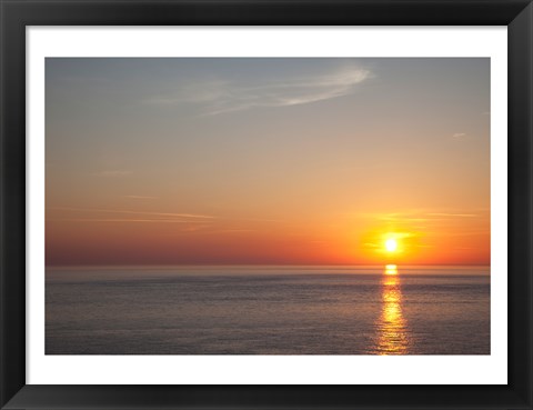 Framed Sunrise over the sea Print