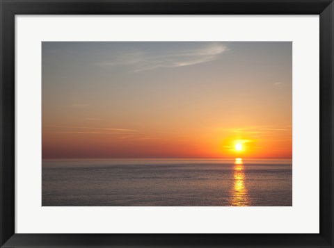 Framed Sunrise over the sea Print